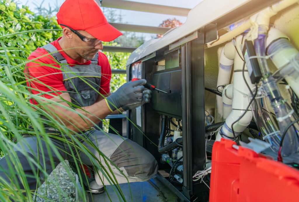 A professional installing electrical heater on a hot tub.