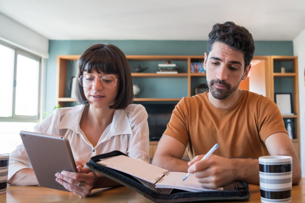 A couple calculating hot tub maintenance costs