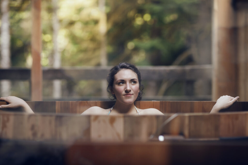 Young woman who chose an all-wood wood-fired hot tub