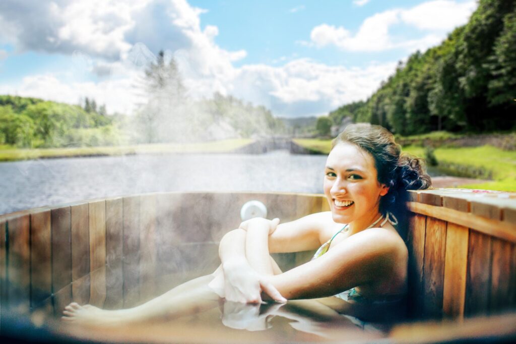 Young smiling woman at sauna hot tub